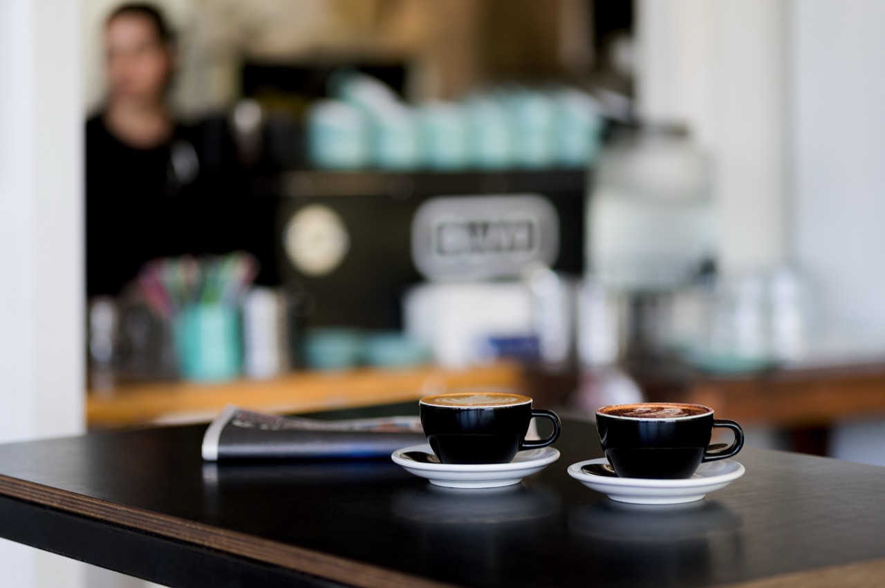 Two coffees on the counter at the BLVD cafe at street level