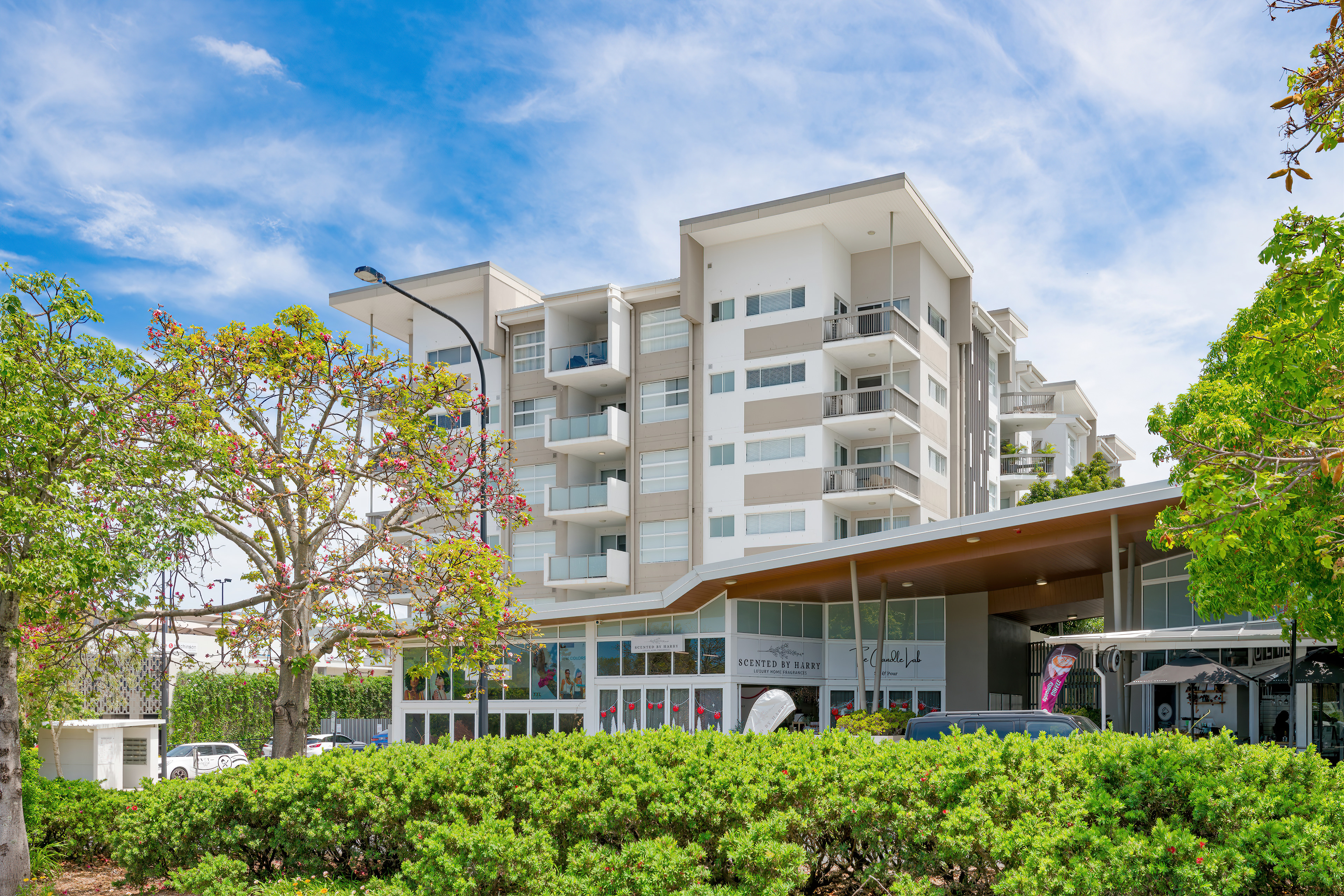 Boulevard North Lakes building from Endeavour Boulevard with frangipani trees