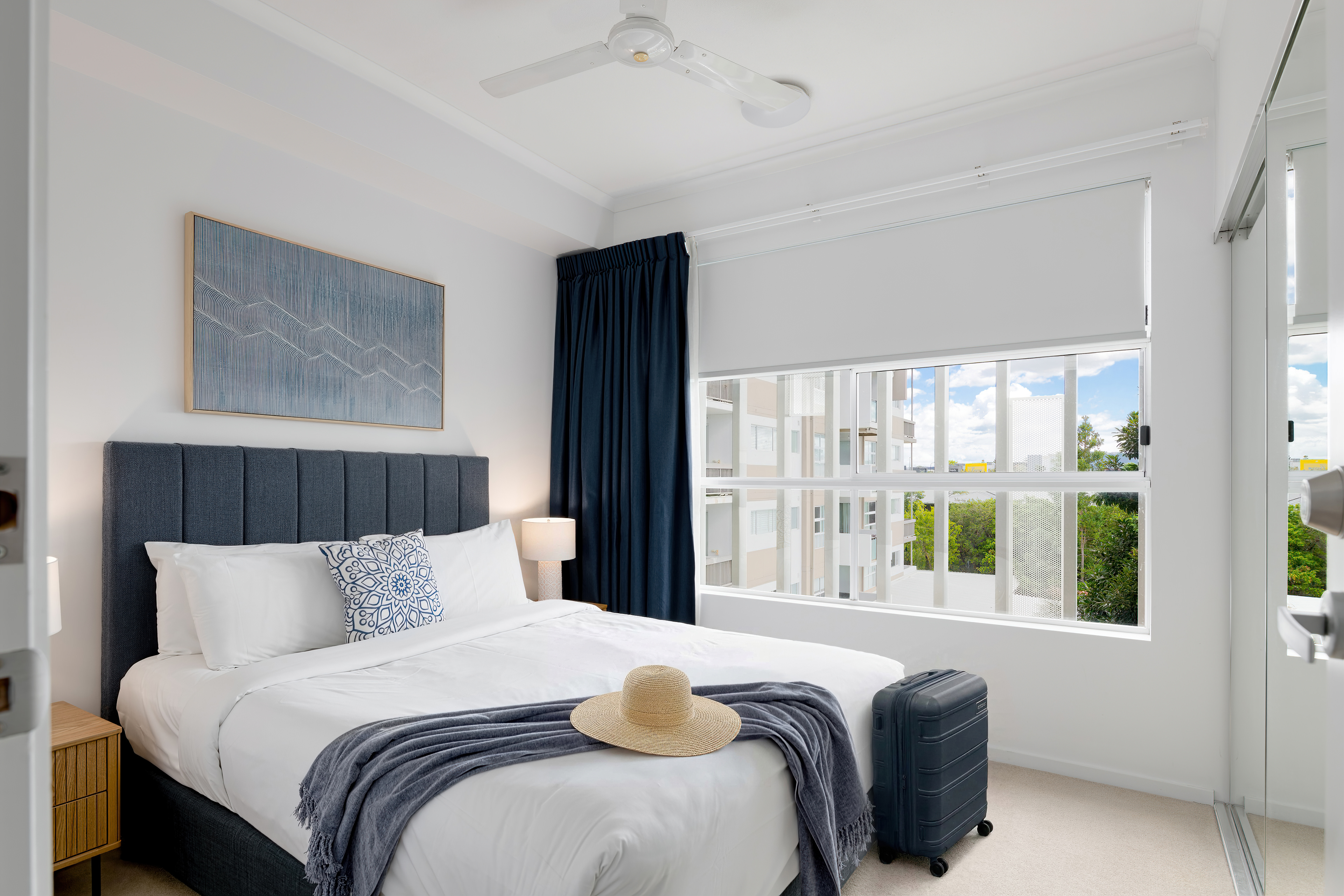 Queen bedroom with bedside lighting
