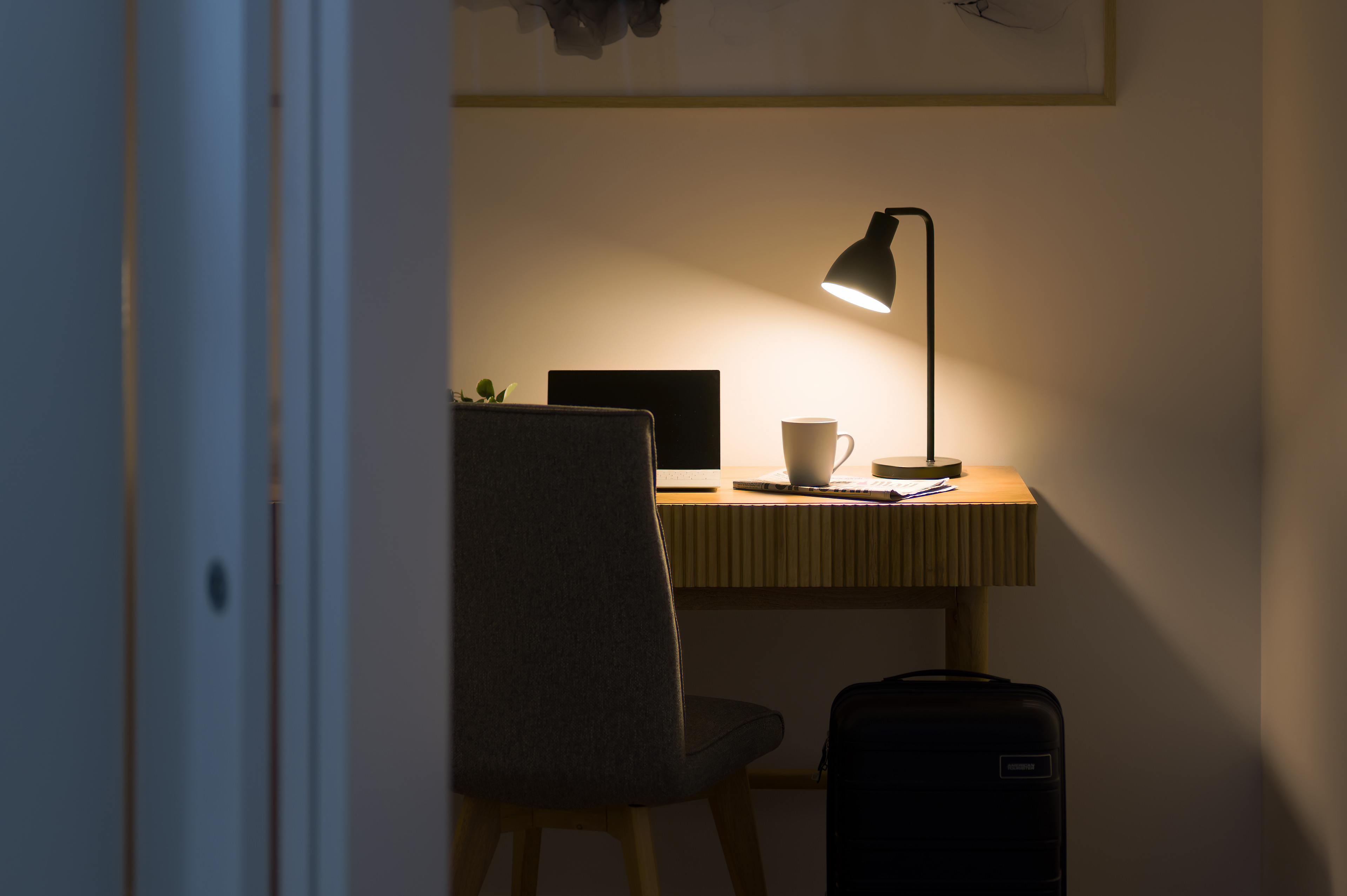 Separate study room with desk, lamp and chair